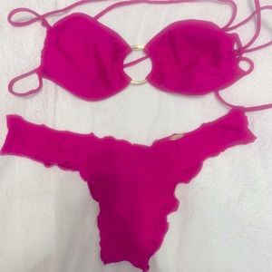 Bright pink bikini, adjustable top.